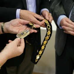 Culvertons' valuers appraise some Mayoral chains of office.